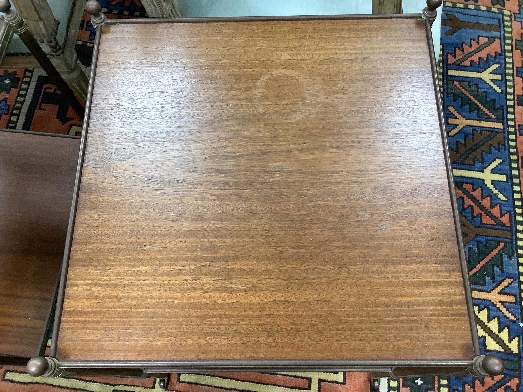 A pair of brass and teak two tier occasional tables, width 44cm depth 44cm height 58cm